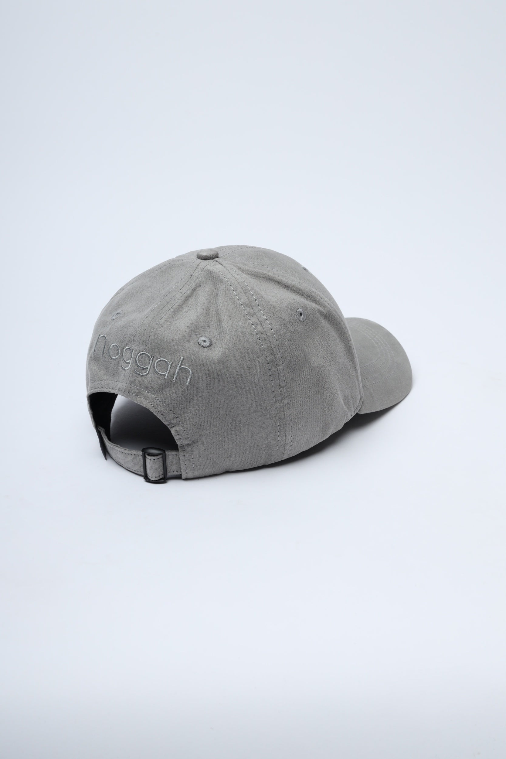 Lightweight travel cap by Noggah in soft grey, worn by male model