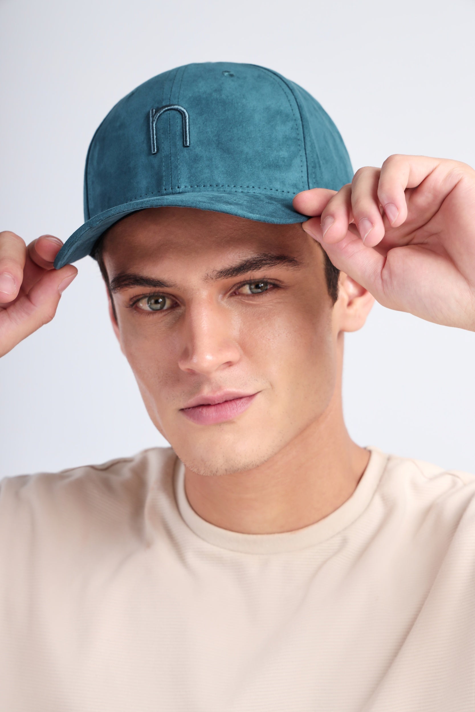 Premium green Noggah cap – suede texture with tonal stitching