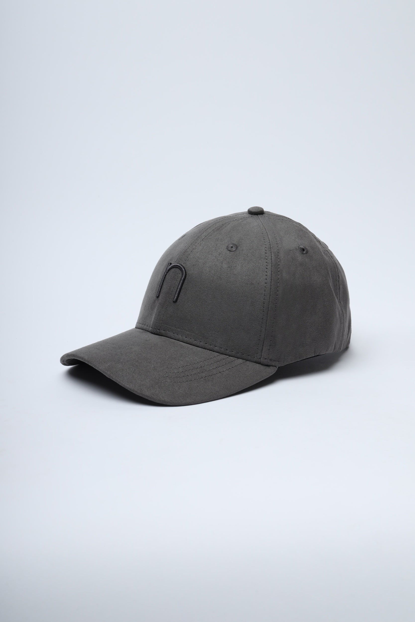 Close-up of NDC003 Night Drive cap showing textured suede and logo detail