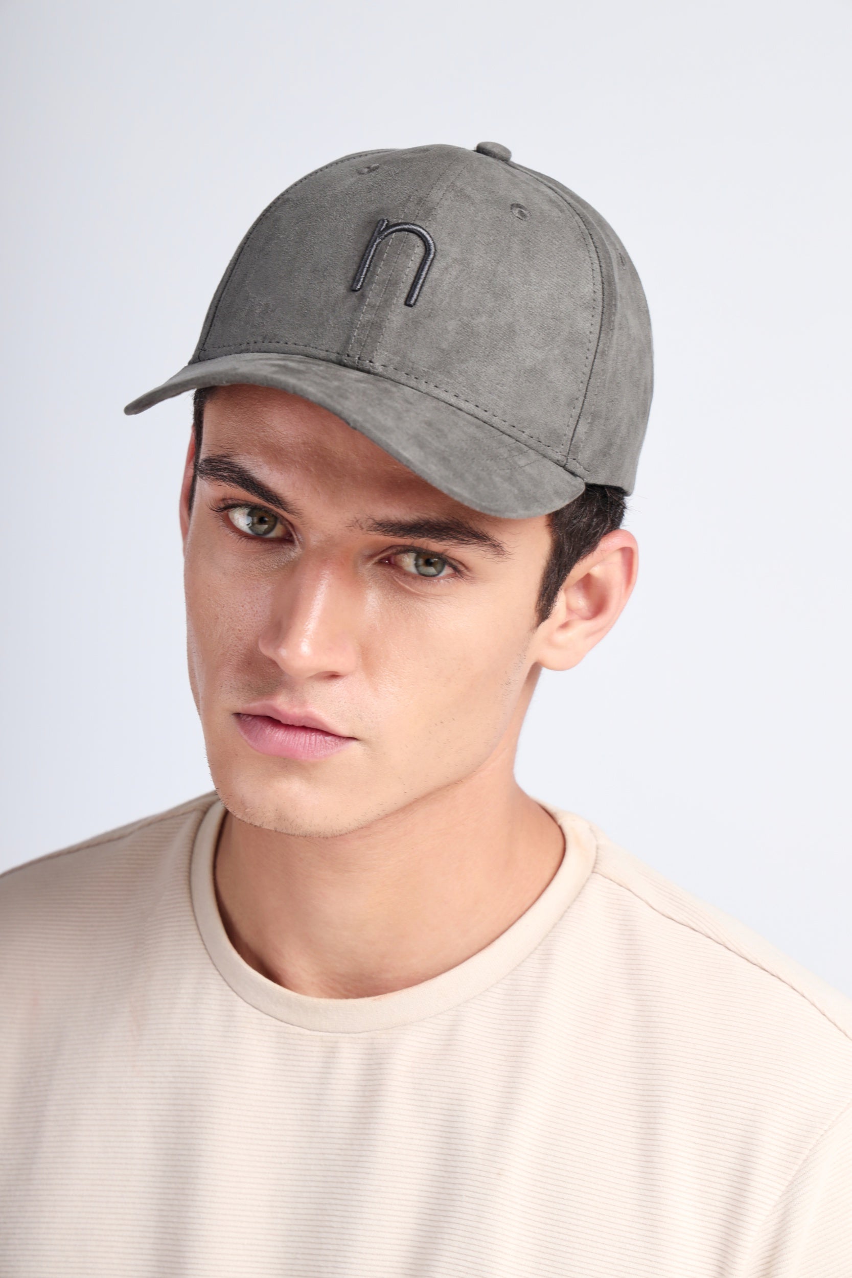 Front view of NDC003 cap in deep grey suede with clean tonal branding