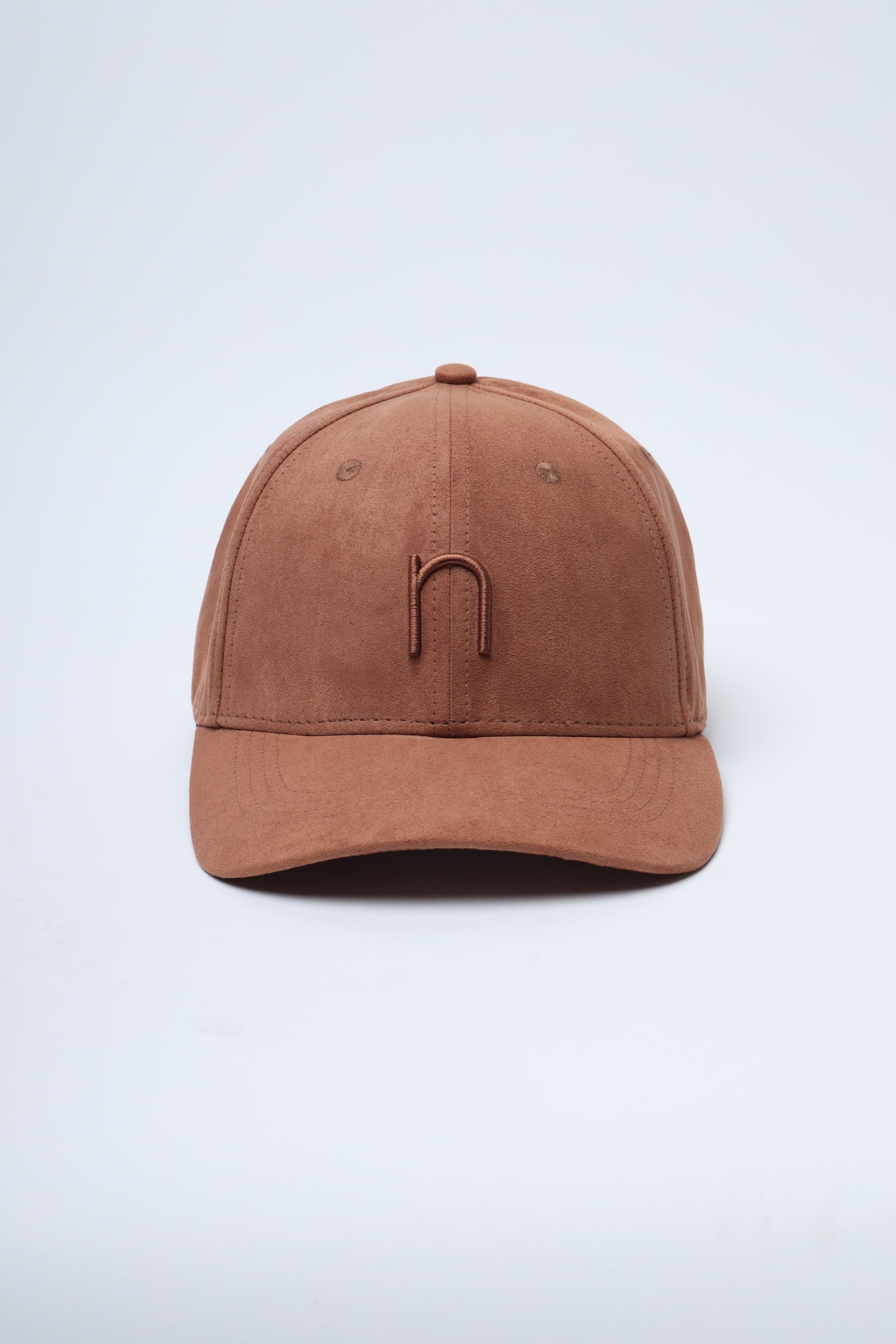 Lifestyle shot of Desert Run cap (NDC004) worn on outdoor adventure