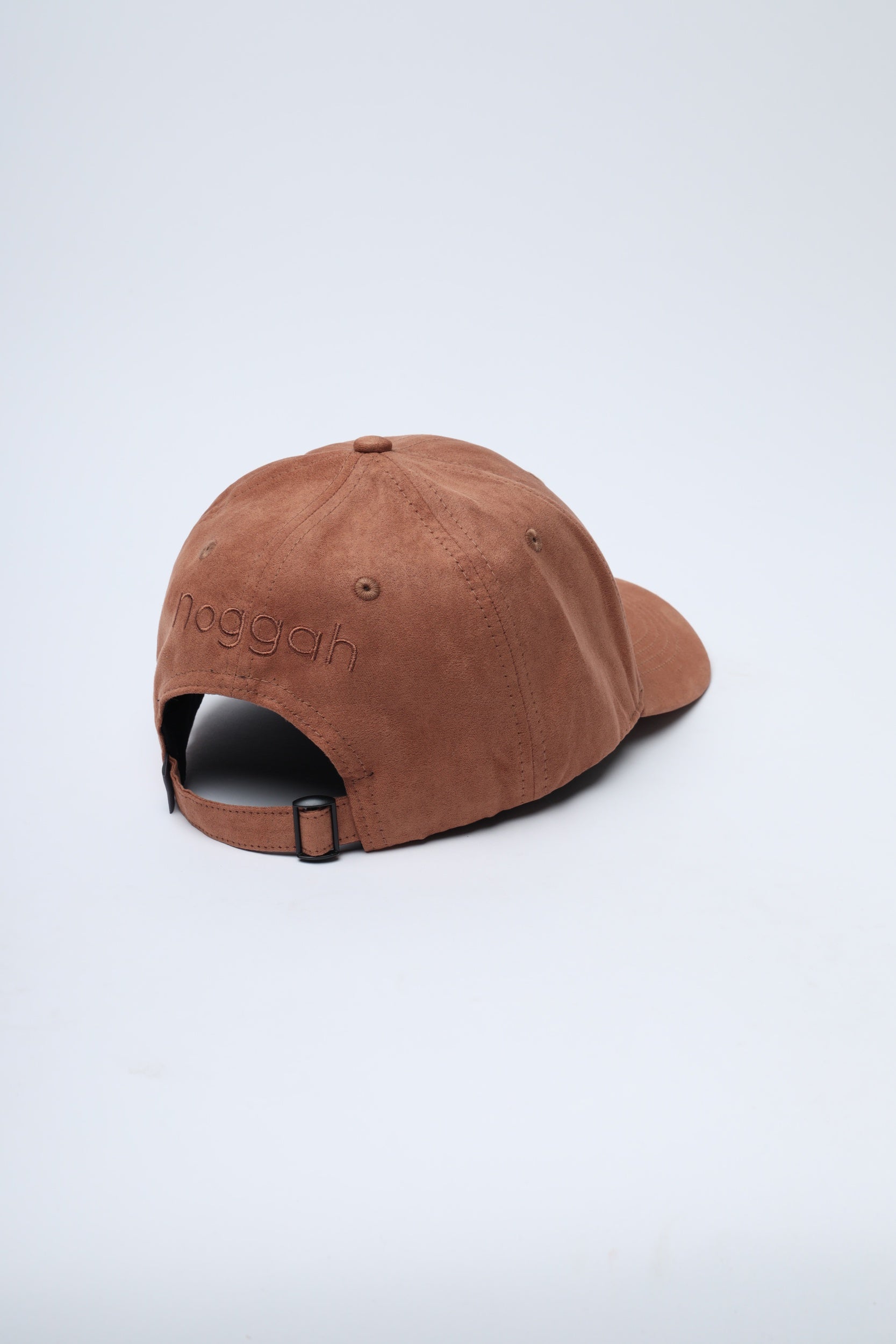 Close-up of NDC004 Desert Run cap showing suede texture and stitching detail
