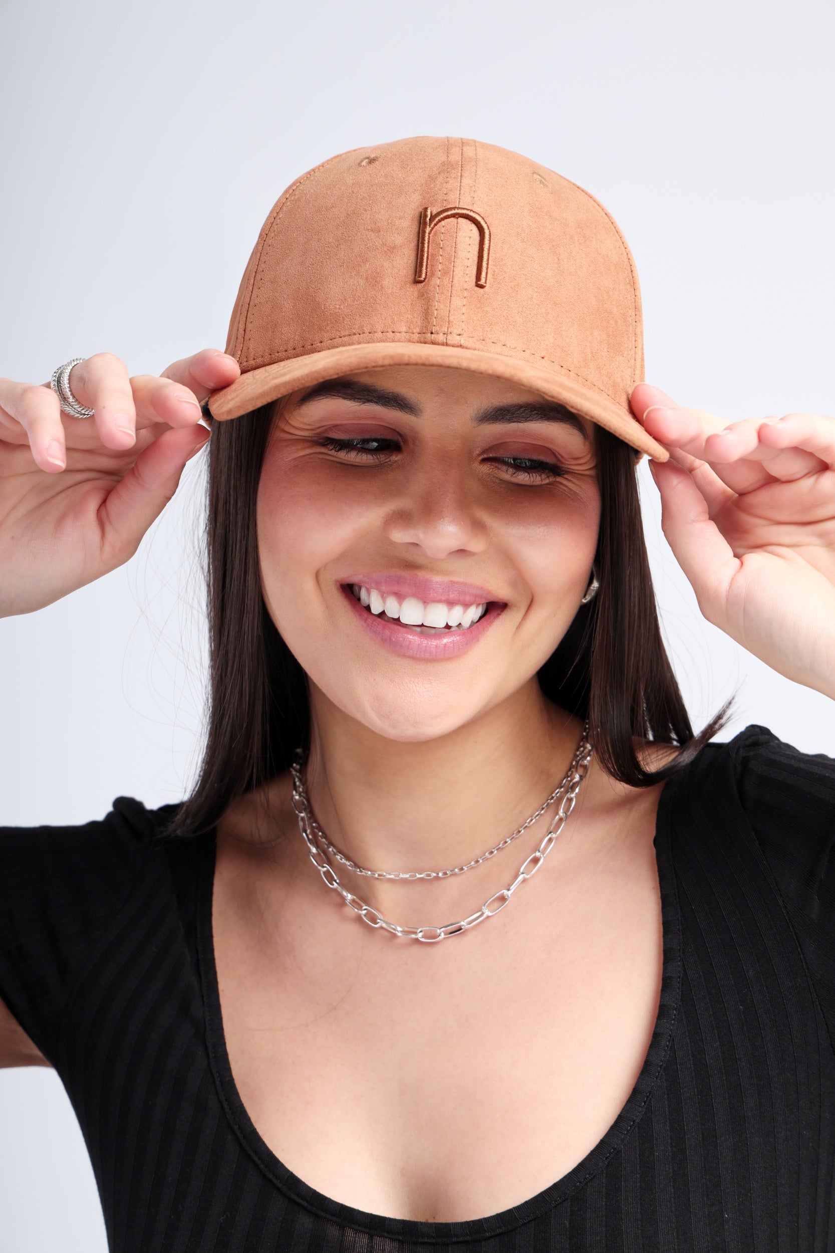 Desert Run cap in soft brown suede with curved brim and embroidered branding