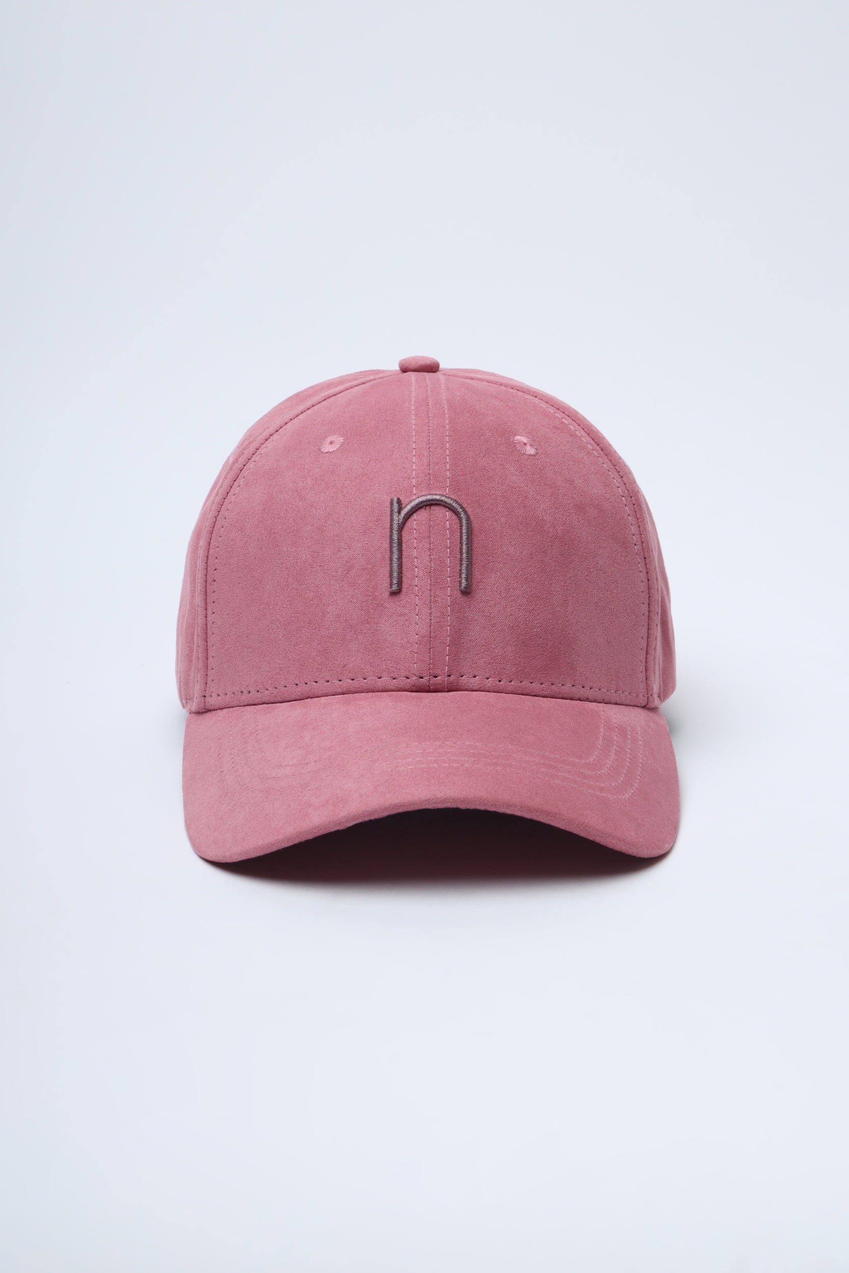 Close-up of Sun Chase cap – soft rose suede and tonal Noggah embroidery